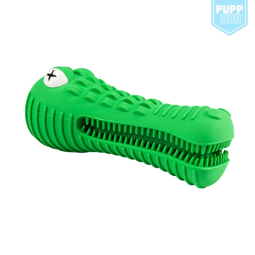 A bright green alligator-shaped dog toy with a ribbed body, textured scales, and a white eye with a black star, shown on a plain white background with a Pupp Hub logo in the top right corner.
